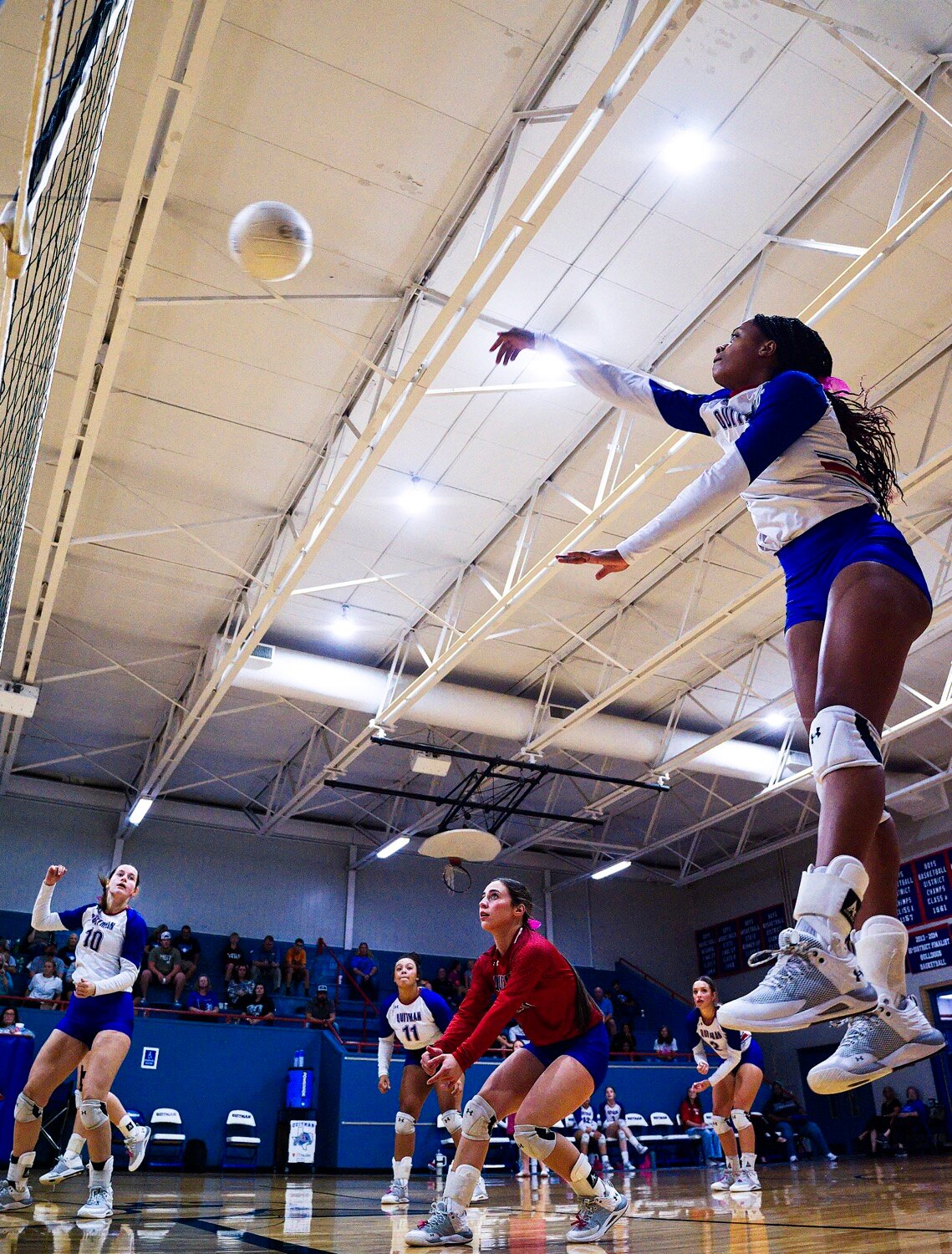 Allie Berry sends the ball over the net. [view more volleyball]